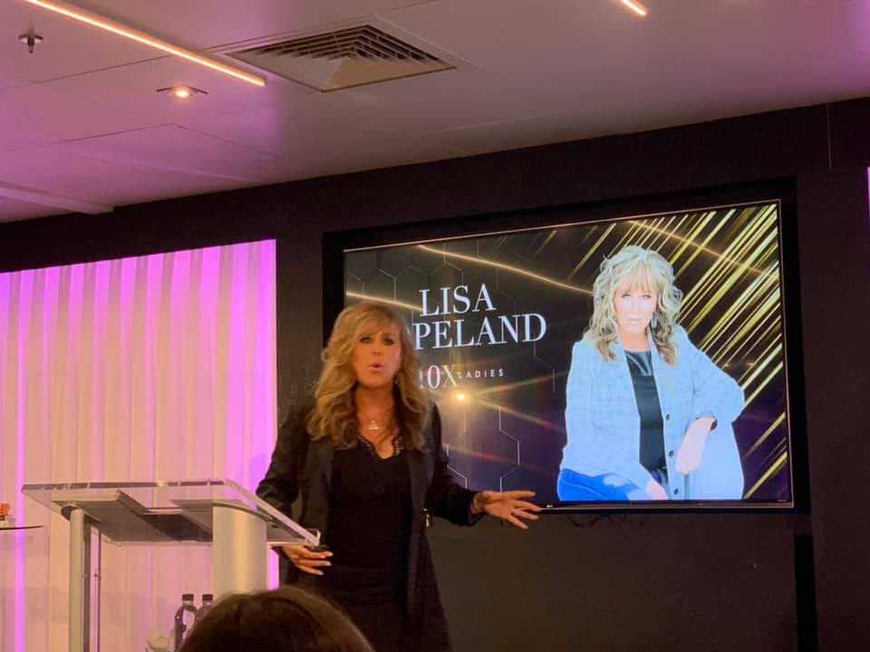 Lisa Copeland speaking on stage, image 3